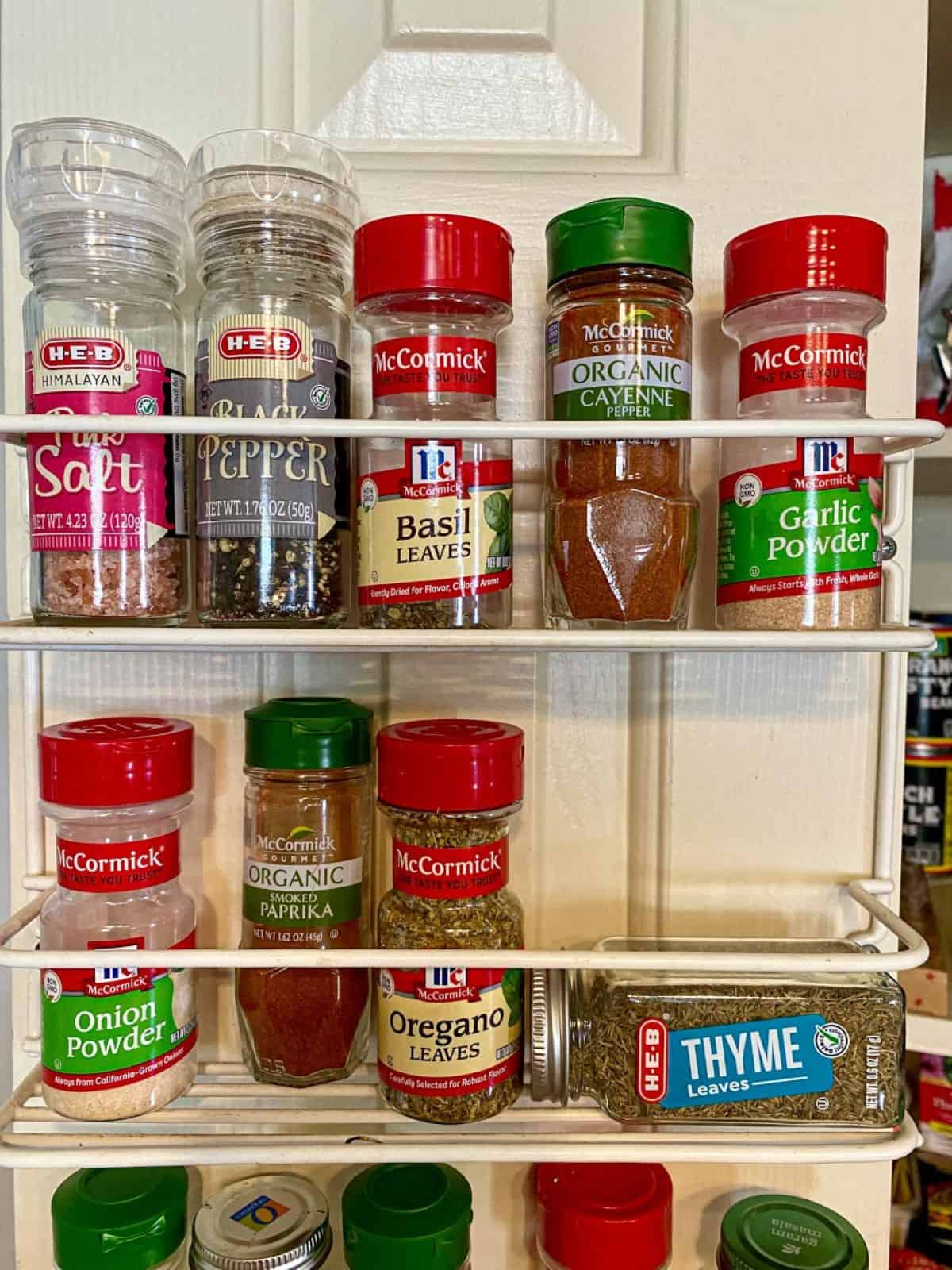 Spice rack in a pantry with blackened spices needed for this recipe.