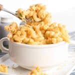 Macaroni and cheese in a bowl with a spoon. A hearty side dish for sloppy joes.