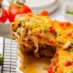 King ranch chicken casserole in a baking dish with a spatula.