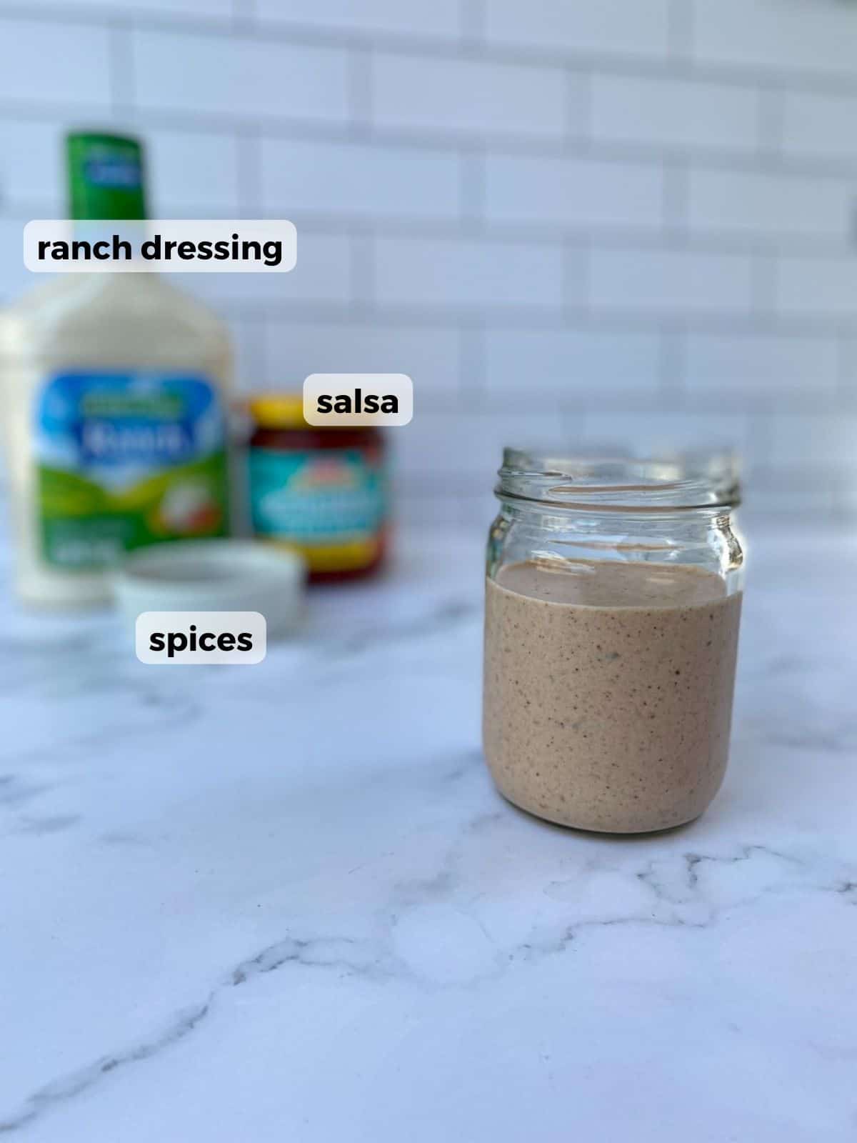 Ingredients needed to make salsa ranch dressing: spices, ranch dressing, and salsa.