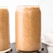 Two meal replacement smoothies in a clear glass. Iced Coffee Protein Shake.