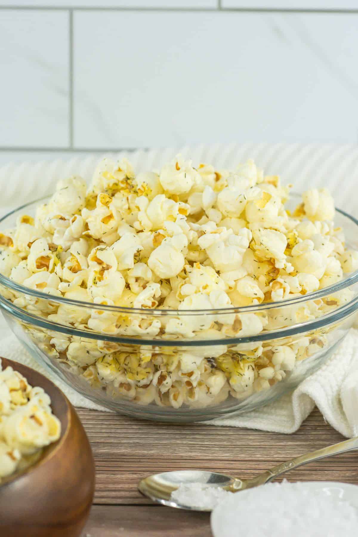 A large bowl of salt and vinegar flavored popcorn.