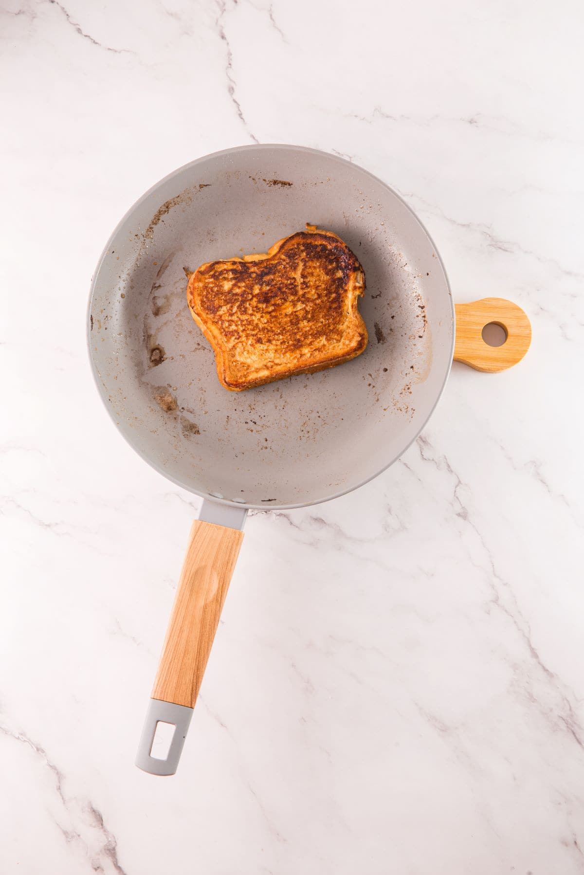 Tiramisu French toast golden brown and cooked in a skillet.