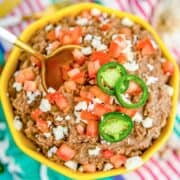 Refried beans with tomatoes and jalapenos is one of the traditional sides for shrimp tacos.