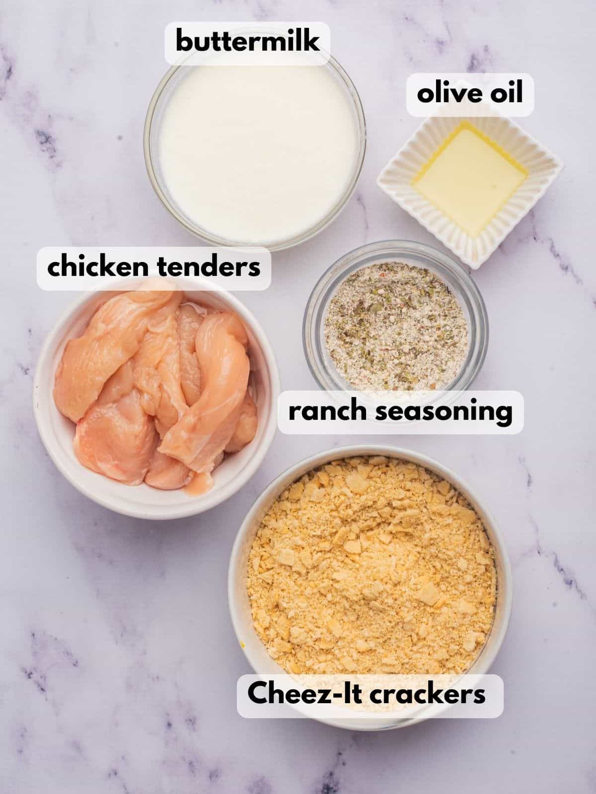 Ingredients needed to make cheesy chicken tenders with cracker crumbs.