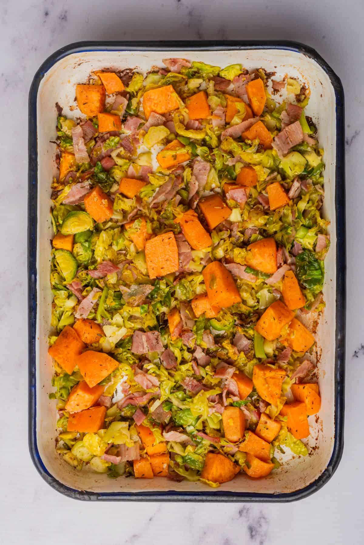 Roasted vegetables on a sheet pan.