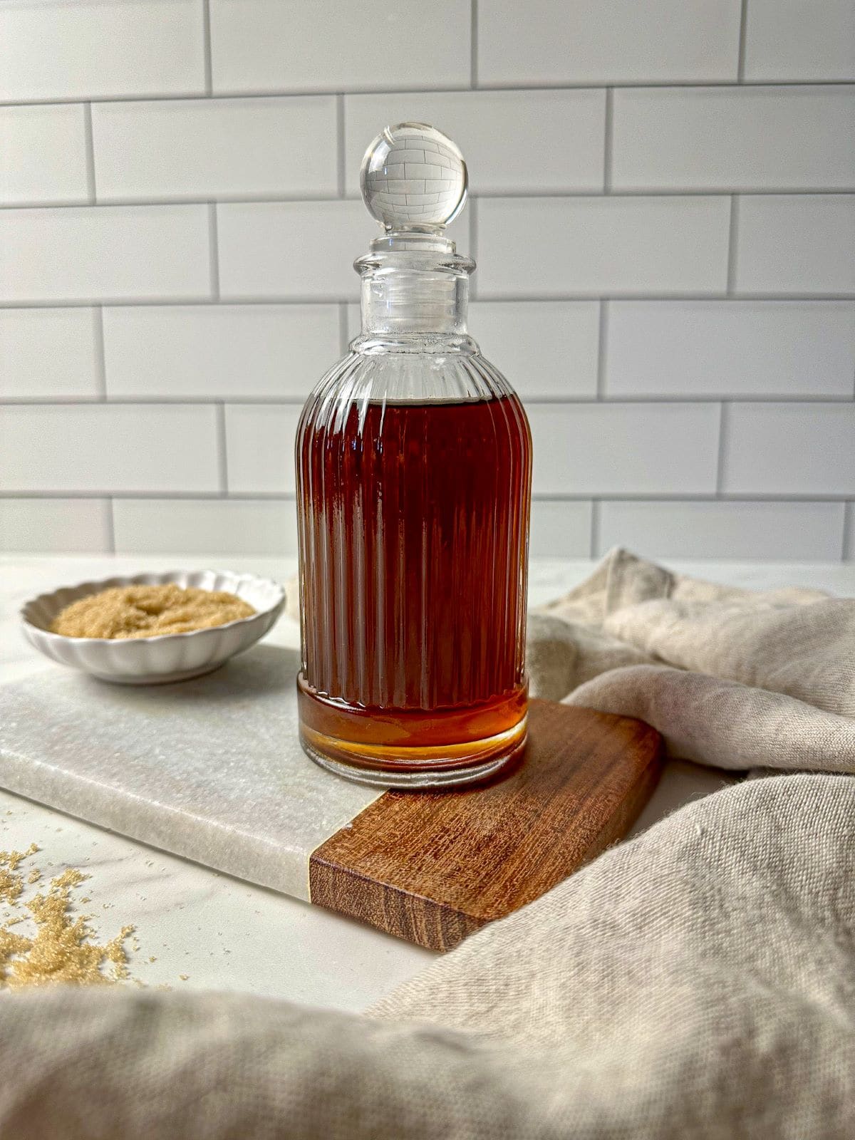 Brown sugar simple syrup in a glass jar.