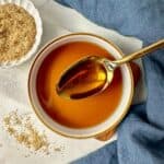 Brown sugar simple syrup in a bowl with a spoon.