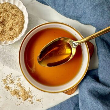 Brown sugar simple syrup in a bowl with a spoon.