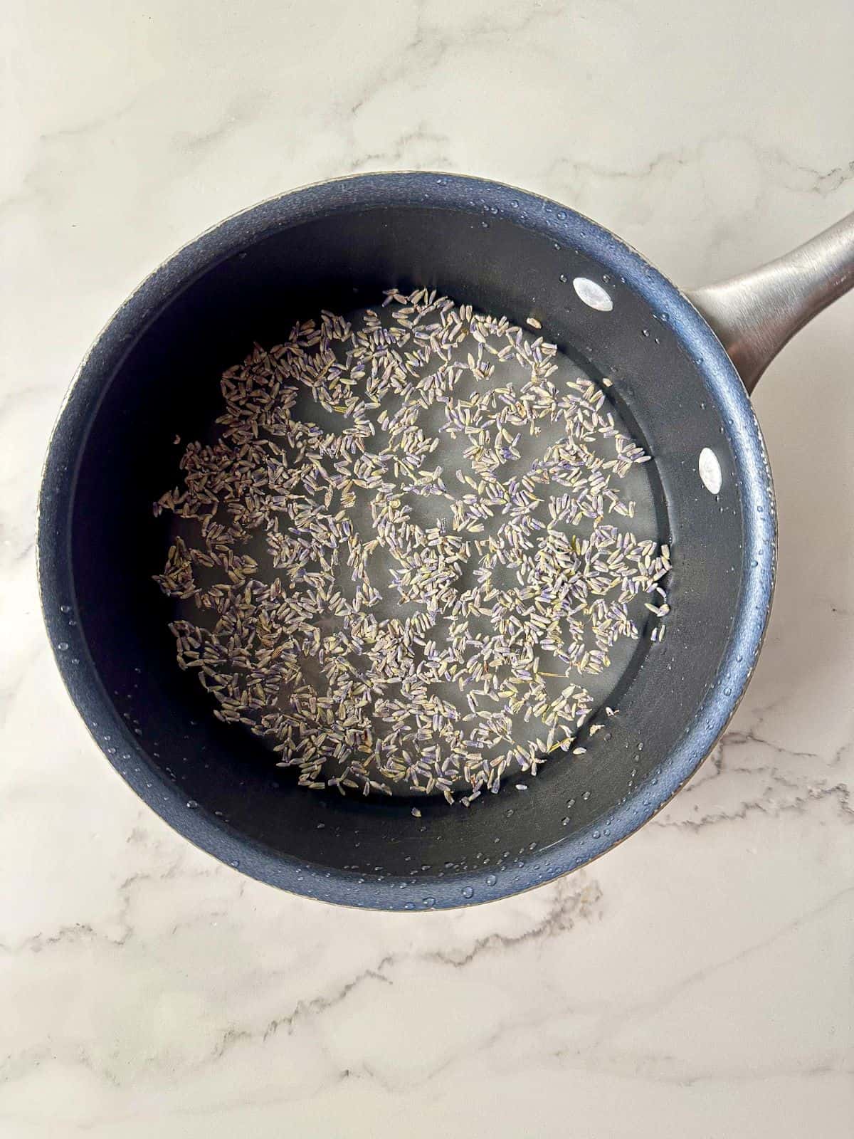 Sugar, lavender, and water in a small saucepan.