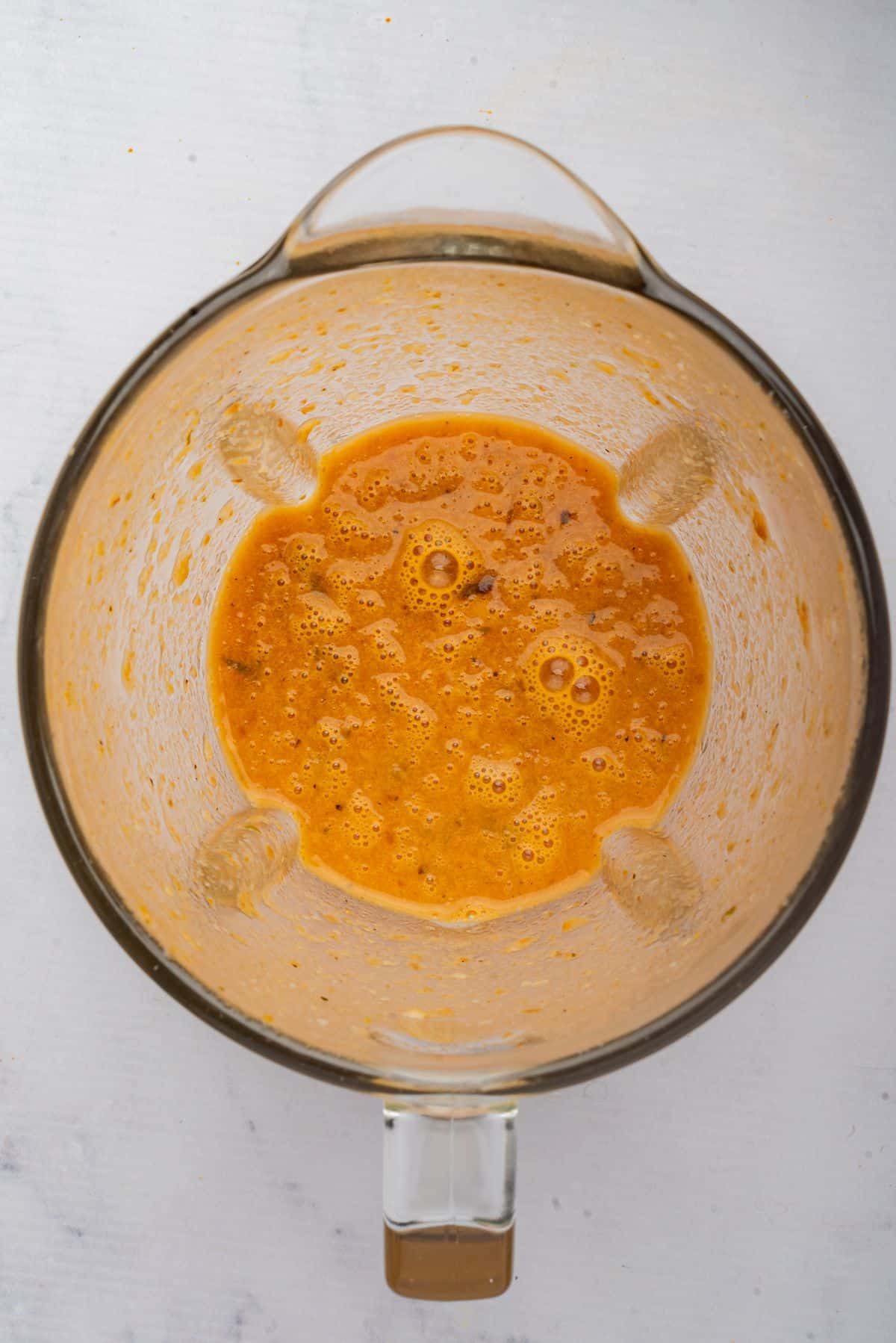 Tortilla chips and soup blended smooth in a blender.