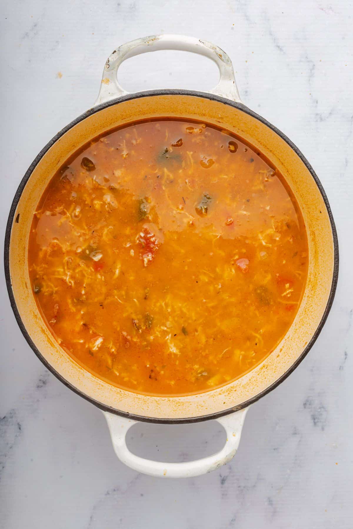 Rotisserie chicken tortilla soup in a large Dutch oven pot.