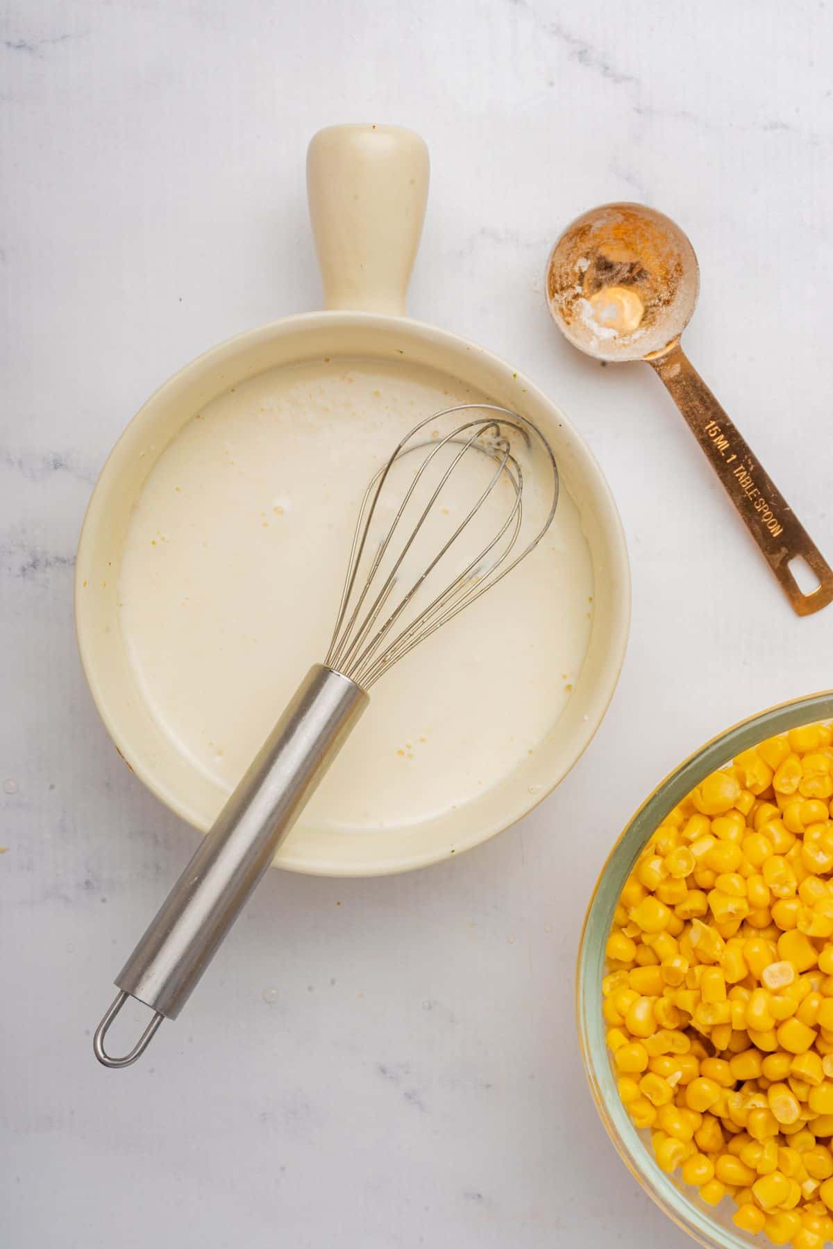 Flour and milk whisked together in a small bowl.