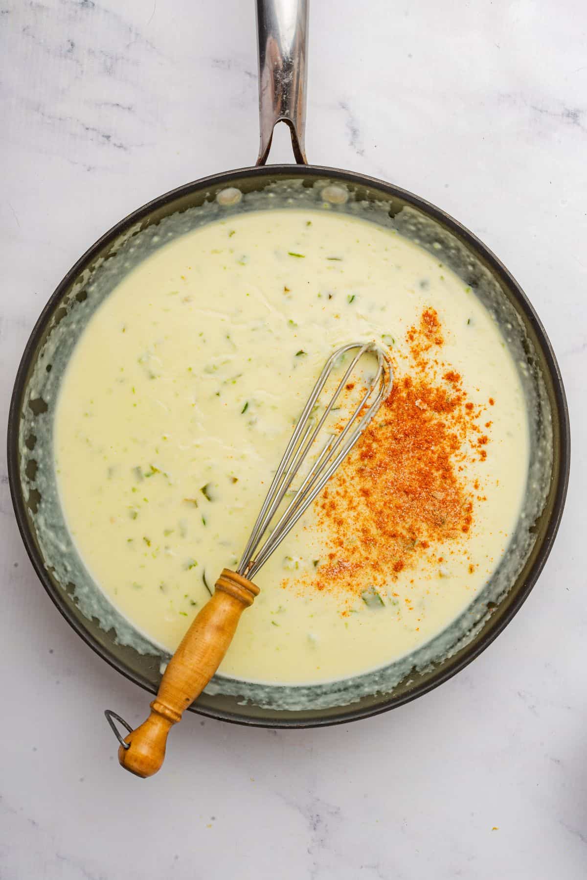 Whisk seasonings into a skillet of cheese sauce.