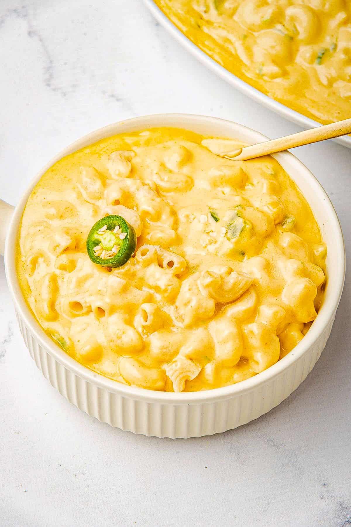 Jalapeno mac and cheese in a bowl with a spoon.