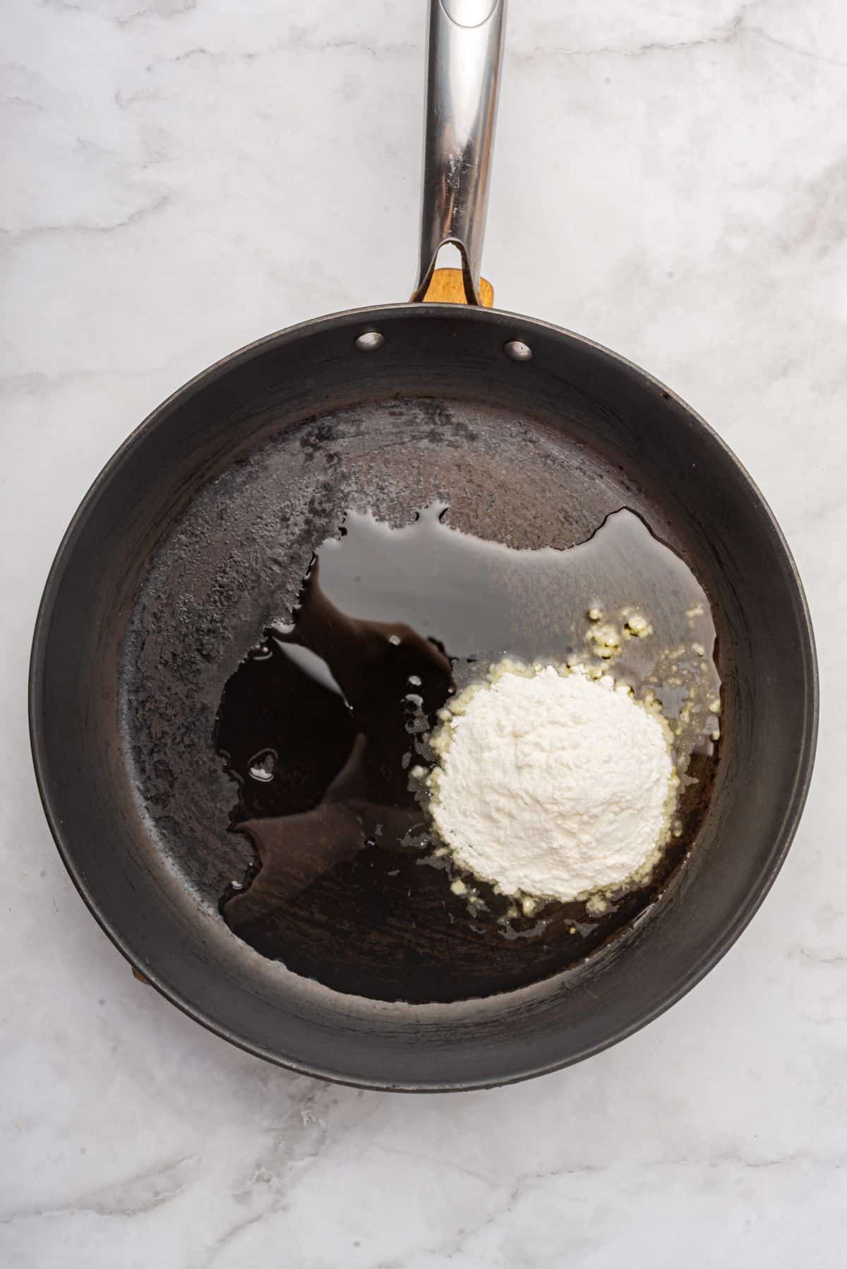 Flour and oil in a saucepan.