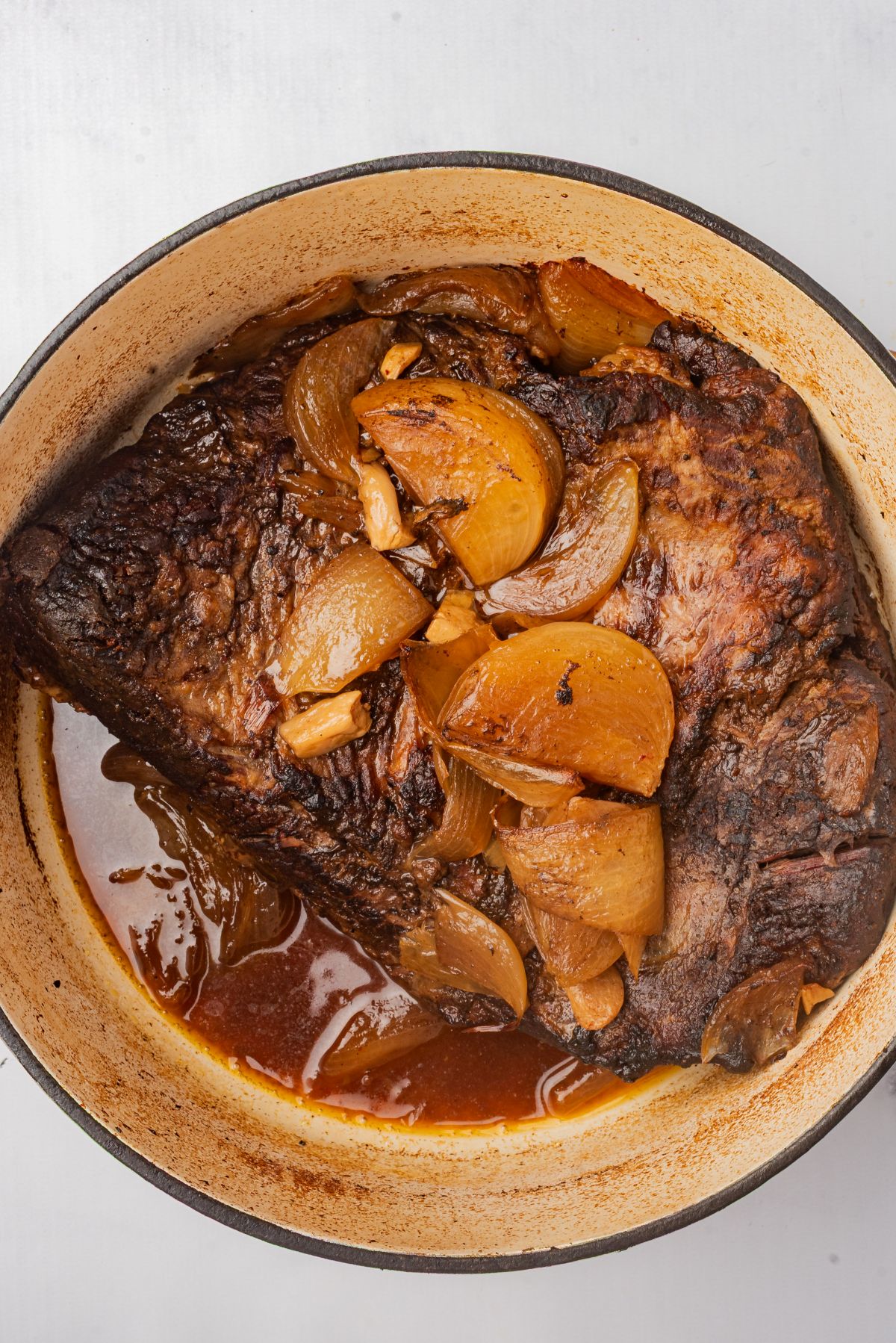 Braised beef brisket in a large pot.