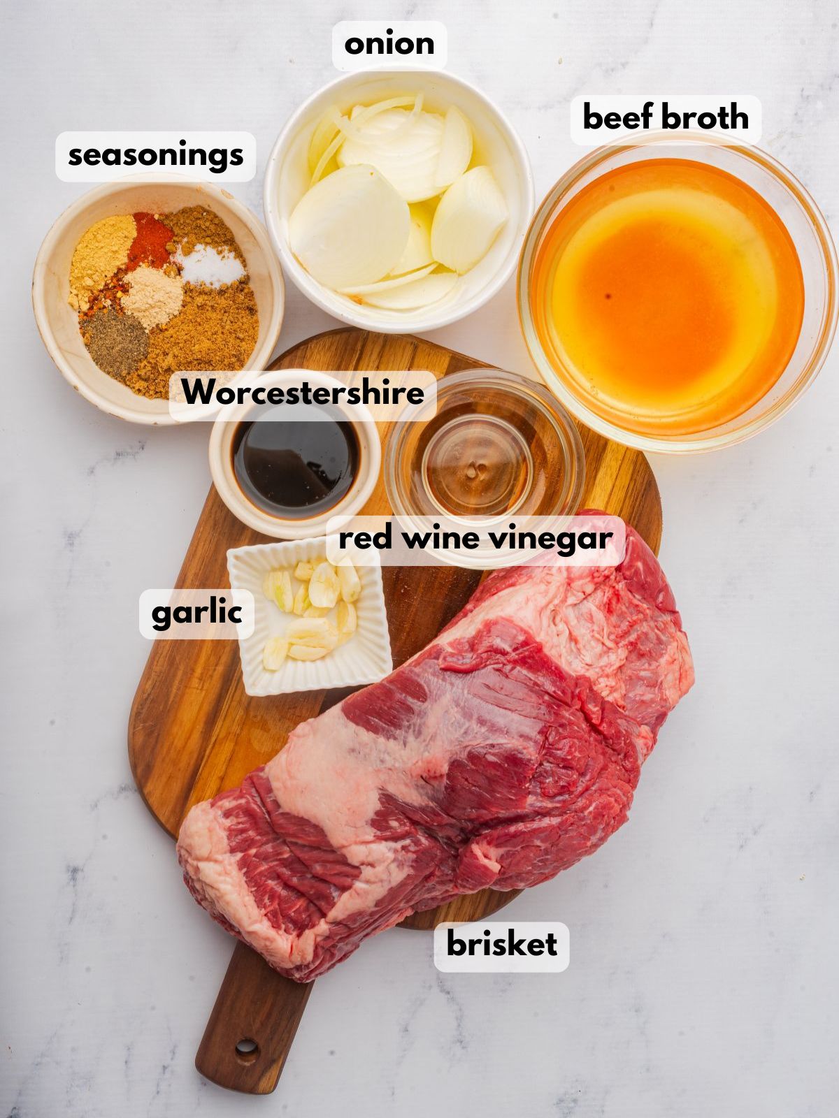 Ingredients needed to cook brisket in a Dutch oven.