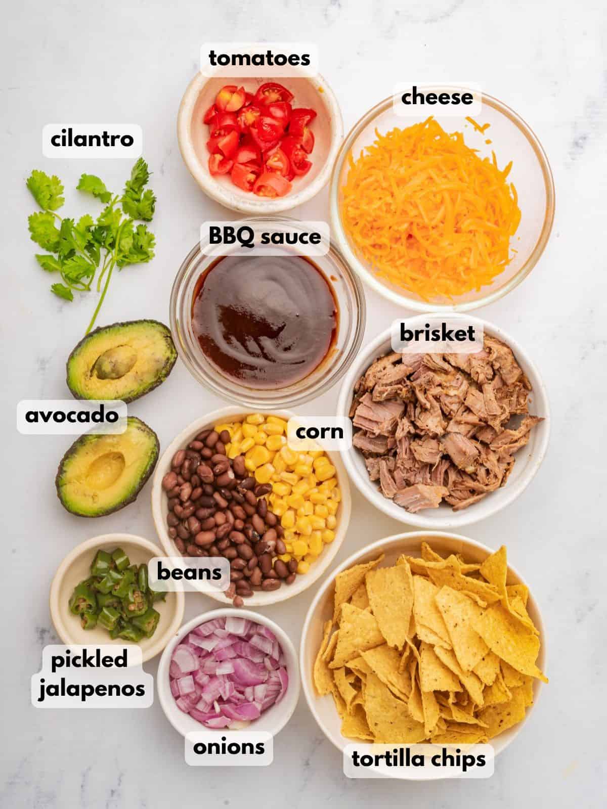 Ingredients needed to make loaded brisket nachos.