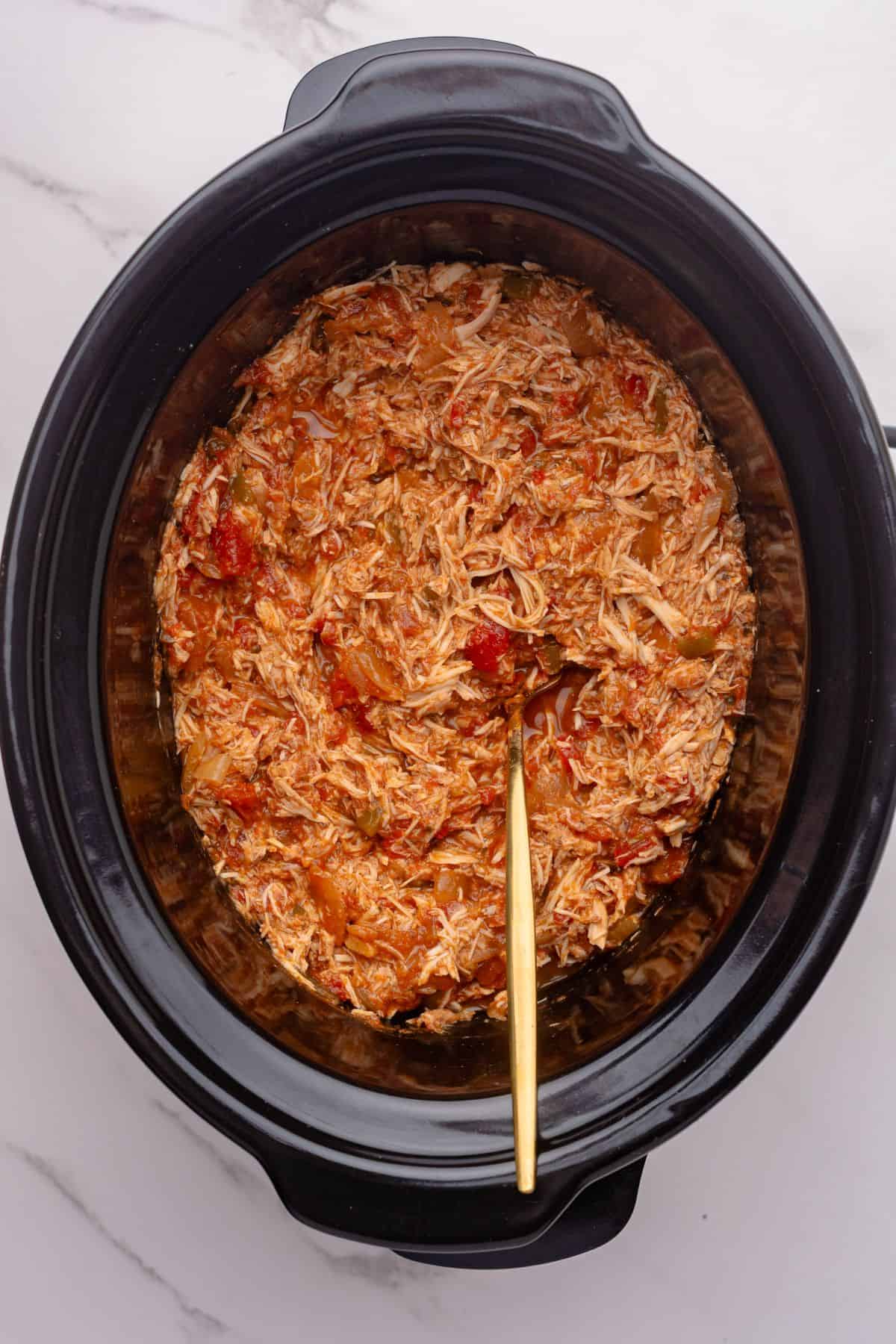 Shredded chicken for tacos in a slow cooker.