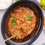 Shredded salsa chicken in a crockpot.