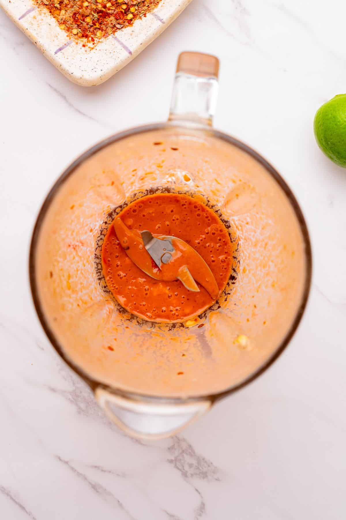 A smooth chipotle crema sauce in a blender.