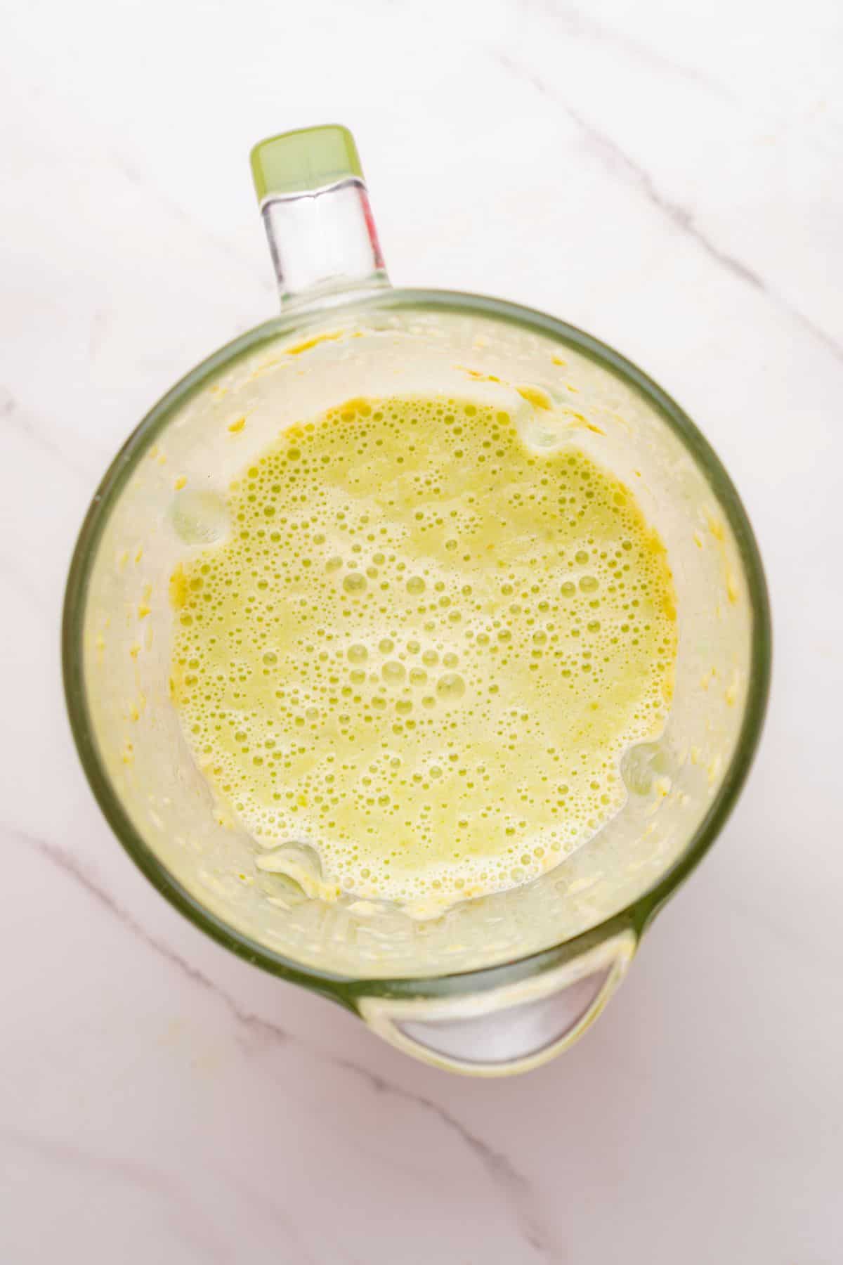 Creamy poblano sauce blended smooth in a blender.