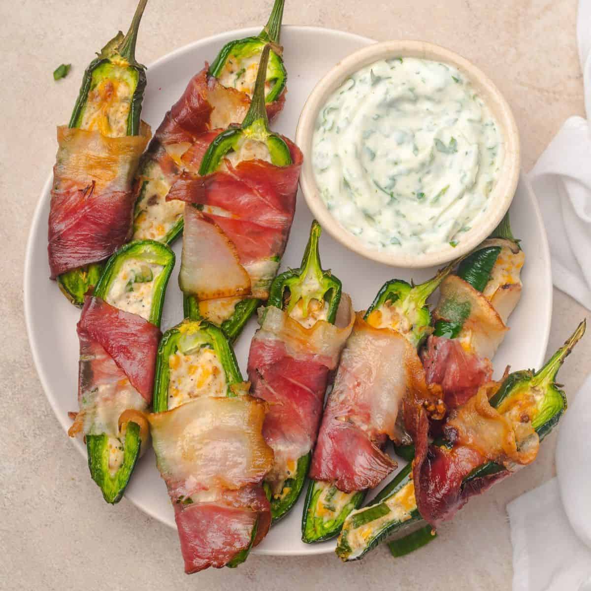 Overhead view of party appetizers and a bowl of dip on a platter.