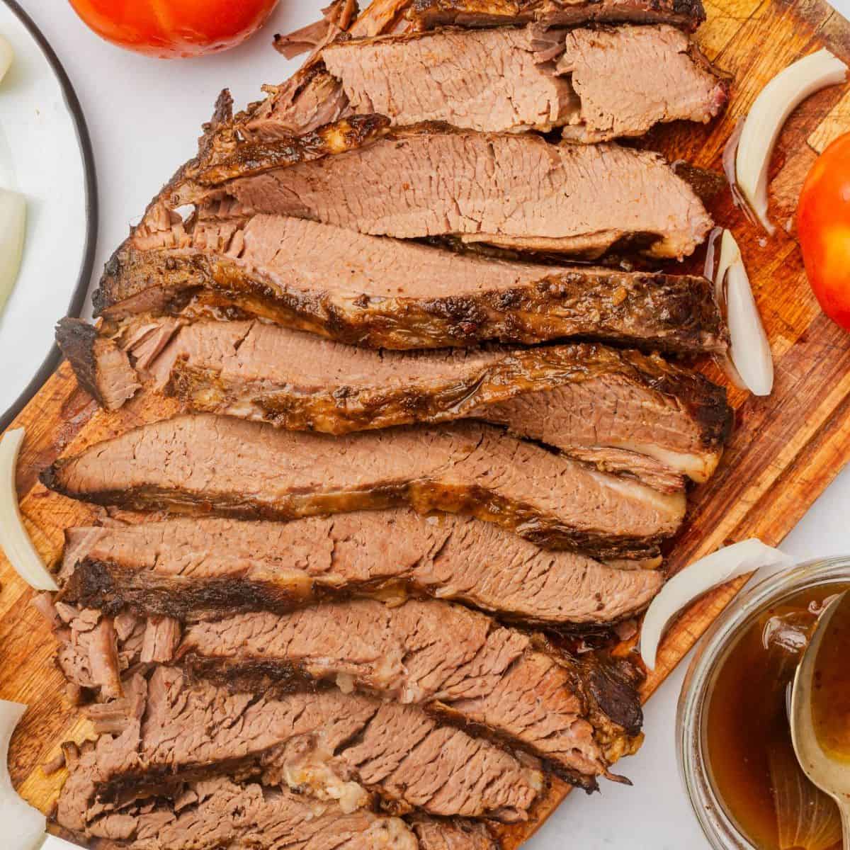 Slices of Texas beef brisket arranged neatly on a serving platter.