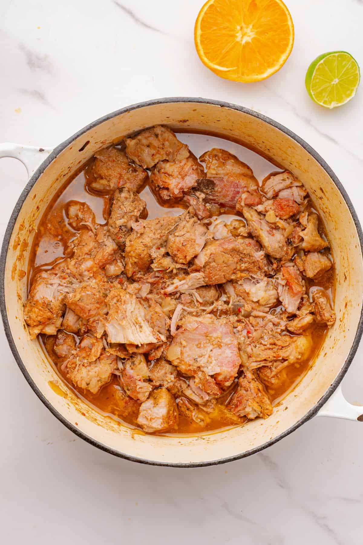 Cooked Dutch oven carnitas.