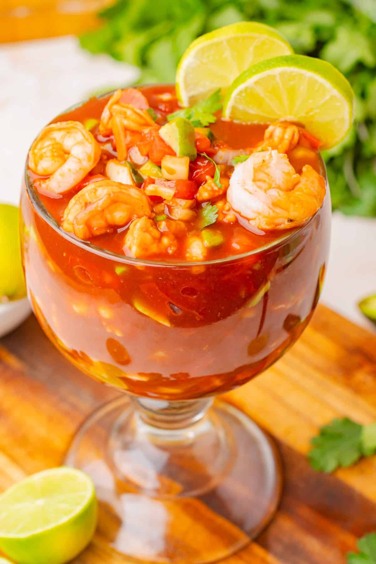 Mexican shrimp cocktail in a clear glass.
