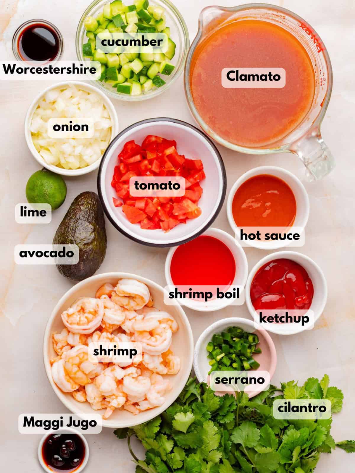 Ingredients needed to make this Mexican shrimp cocktail recipe are on a countertop.