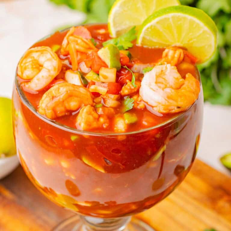 Mexican shrimp cocktail in a clear glass.