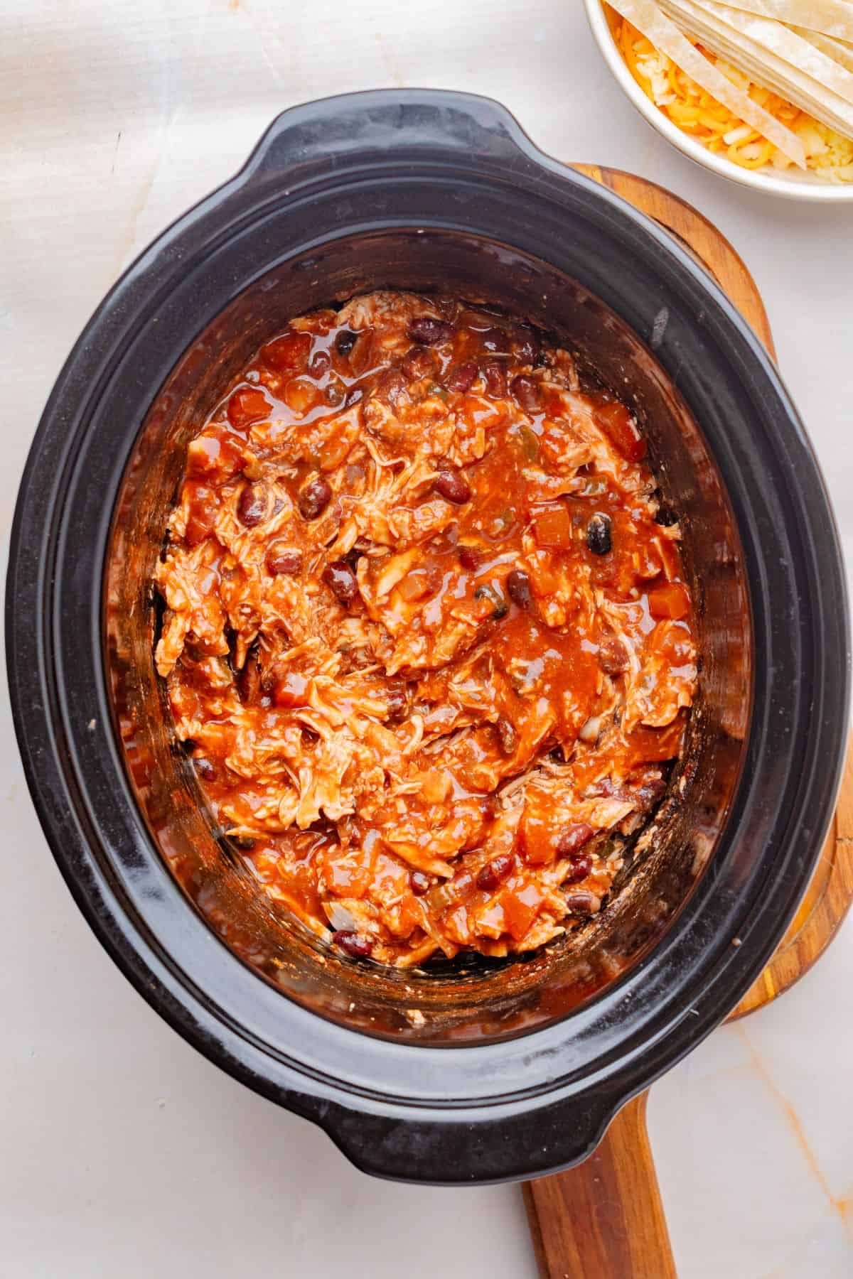 Shredded chicken added back to the slow cooker.